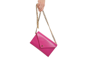 Girl with a hot pink leather High Fashion Thermal Designer Handbag by La Coutts Toronto