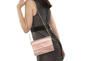 Girl with a pink snake like leather High Fashion Thermal Designer Handbag by La Coutts Toronto